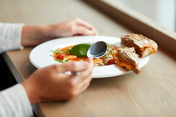 Image showing woman eating gazpacho soup at restaurant