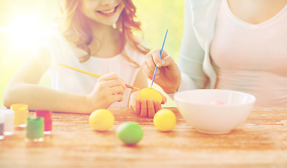 Image showing close up of family coloring easter eggs