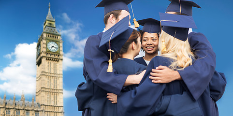 Image showing happy students or bachelors hugging