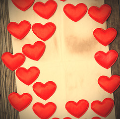 Image showing blank old paper with red hearts