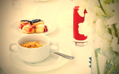 Image showing breakfast. oatmeal and corn flakes