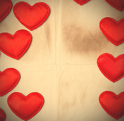 Image showing old paper background with red hearts