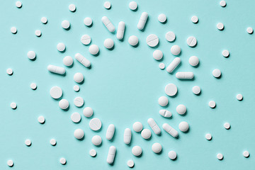 Image showing white pills on blue background