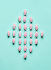 Image showing pink pills on blue background