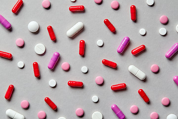 Image showing colorful pills on grey background