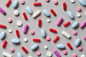 Image showing colorful pills on grey background