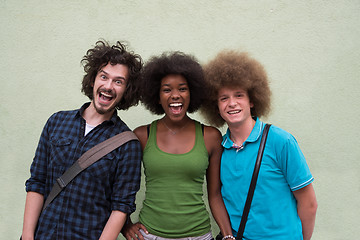 Image showing multiethnic group of happy three friends