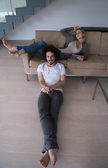 Image showing young couple relaxes in the living room