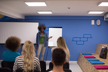 Image showing Black woman Speaker Seminar Corporate Business Meeting Concept