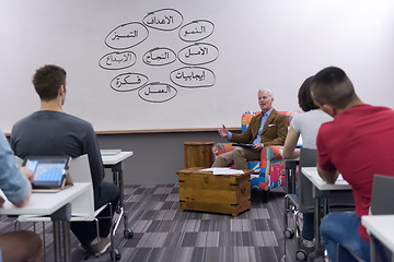 Image showing senior professor with students on course