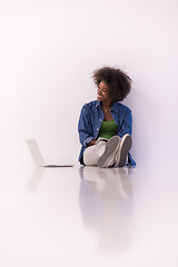 Image showing african american woman sitting on floor with laptop