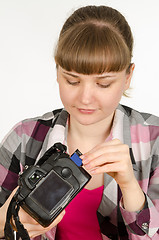 Image showing Photographer inserts a flash drive into the camera