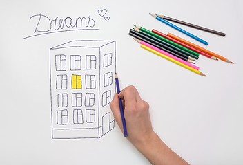 Image showing Hand painted on the drawing paper with crayons multi-storey building, light in the apartment and the inscription dream