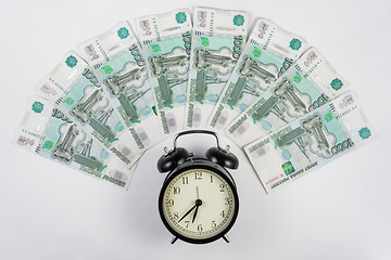 Image showing Around alarm fan lined thousandths ruble bills