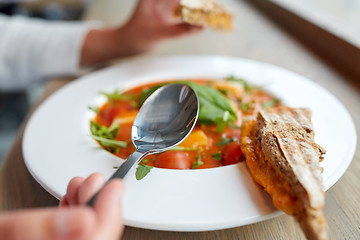 Image showing woman eating gazpacho soup at restaurant