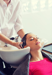 Image showing happy young woman at hair salon