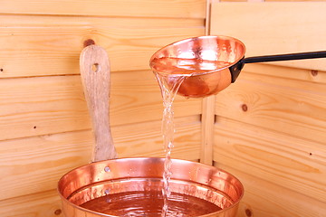 Image showing Pouring water in sauna