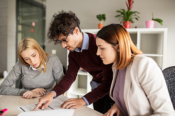 Image showing happy business team with papers in office