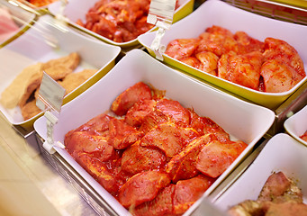 Image showing marinated meat in bowls at grocery stall