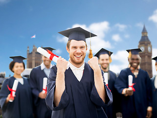 Image showing happy student with diploma celebrating graduation