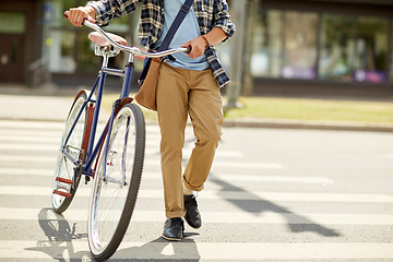 Image showing young man with fixed gear bicycle on crosswalk