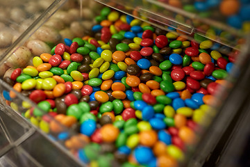 Image showing close up of multicolored dragee candies in box