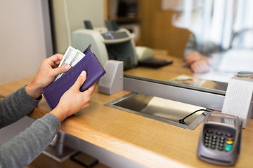 Image showing hands with money at bank or currency exchanger