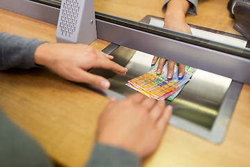 Image showing clerk giving cash money to customer at bank office