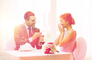 Image showing man proposing to his girlfriend at restaurant