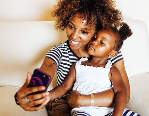 Image showing adorable sweet young afro-american mother with cute little daugh