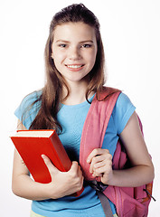 Image showing young cute teenage girl posing cheerful against white background with books and backpack isolated