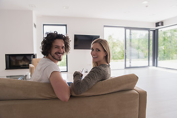 Image showing Rear view of couple watching television