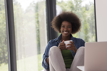 Image showing African American woman in the living room