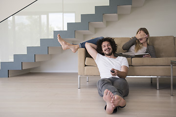 Image showing young couple relaxes in the living room