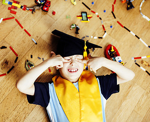 Image showing little cute preschooler boy among toys lego at home education in