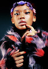 Image showing young pretty african american woman in spotted fur coat and flow