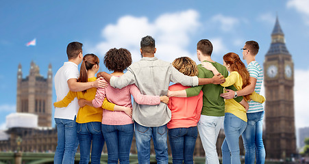 Image showing international group of people hugging over london