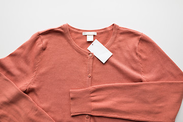 Image showing close up of cardigan with price tag