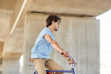 Image showing  hipster man riding fixed gear bike