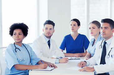 Image showing group of happy doctors on conference at hospital