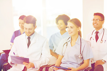 Image showing group of happy doctors on seminar at hospital