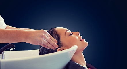 Image showing happy young woman at hair salon