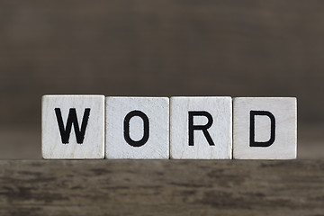 Image showing Word, written in cubes on wooden background