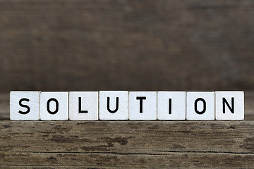 Image showing Solution, written in cubes on wooden background