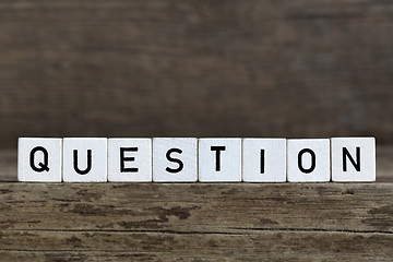 Image showing Question, written in cubes on wooden background