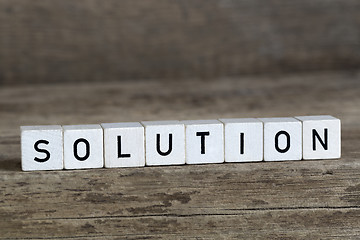 Image showing Solution, written in cubes on wooden background