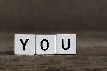 Image showing You, written in cubes on wooden background