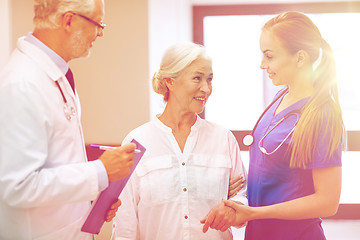 Image showing medics and senior patient woman at hospital