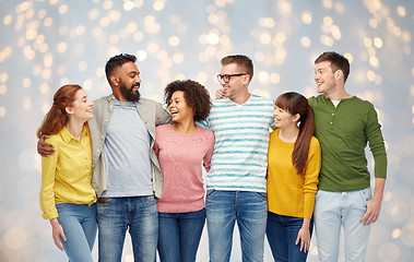 Image showing international group of happy people over lights