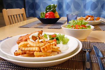 Image showing French fries and chicken
